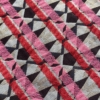 Jacquard di cotone schegge fucsia e rosso